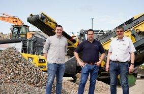 Jannik Woitzel, Julian Pollmeyer and Uwe Woitzel in front of the R3 impact crusher. (LTR)