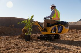Komatsu's PC01E electric micro excavator, developed jointly with Honda, is powered by portable and swappable mobile batteries.