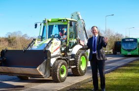Technology and Decarbonisation Minister Jesse Norman pictured in Rocester, Staffordshire, today with a JCB backhoe loader powered by a hydrogen combustion engine. The visit came as the Government grants approval for the machine to be driven on UK roads.