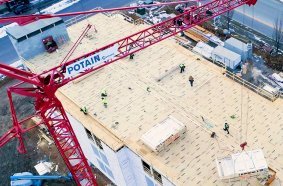 The Potain self-erecting crane makes Cedar Run’s crew more efficient by placing materials precisely where they are needed.