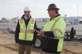 Brent Droege (left), Cedar Run’s financial director, discusses project details with Chad Jacobs, self-erecting tower crane specialist at Potain dealer Stephenson Equipment.