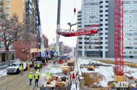 Potain tower cranes help transform Madison’s downtown skyline under an airport flight path