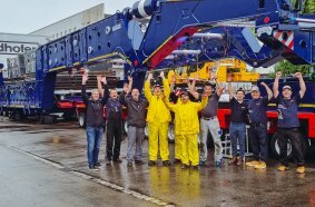 Proud faces: the combined Collett, Goldhofer and Greiner team during overload testing.