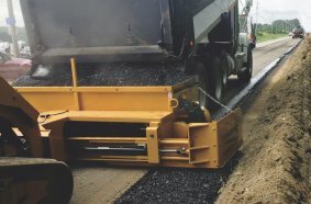 Road Widener’s FH-R Material Placement  Attachment Reduces Labor by 50%