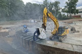 Demolition using an excavator with a DMW 220 cutter wheel