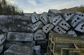 The cut-out sections of concrete cable duct are transported out of the tunnel and ready for recycling.
