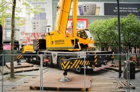   The GMK6300L-1 crane was set up in a tight jobsite with 74.5 t of counterweight, 80 m main boom, and 37 m and 29 m hydraulic swingaway jibs.