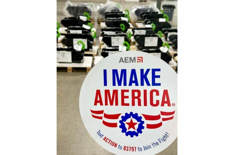 I Make America logo with Steelwrist quick couplers in the background<br>IMAGE SOURCE: Steelwrist AB