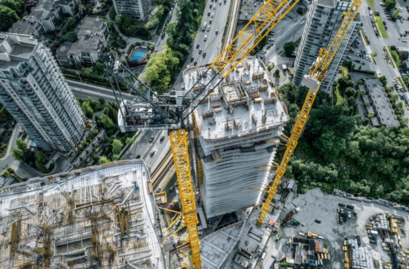 The luffing jib cranes climb external to the building. Liebherr's Tower Crane Solutions project department assisted with the concept.<br>IMAGE SOURCE: Liebherr-International Deutschland GmbH