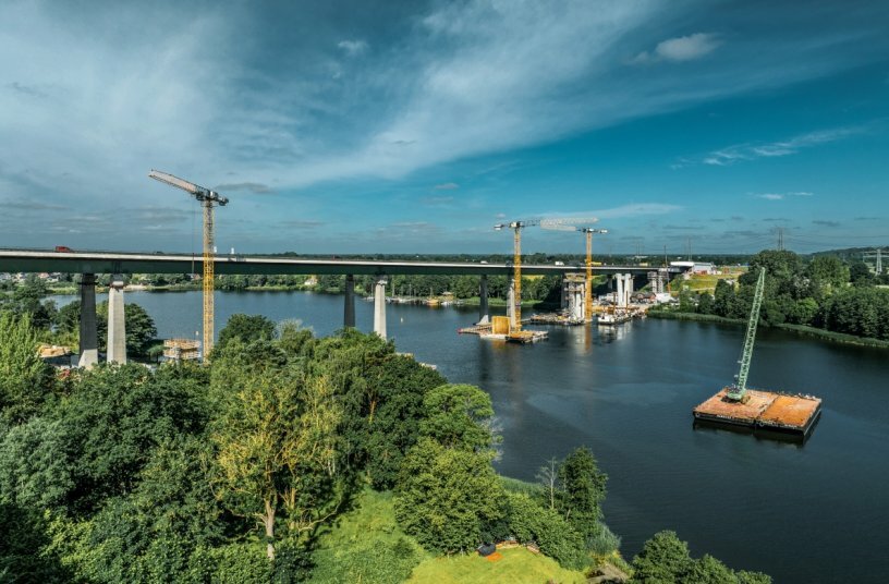 A crawler crane on a floating platform is used for assembly. The disassembled crane is transported to its new location by ferry.<br>IMAGE SOURCE: Liebherr-Werk Biberach GmbH