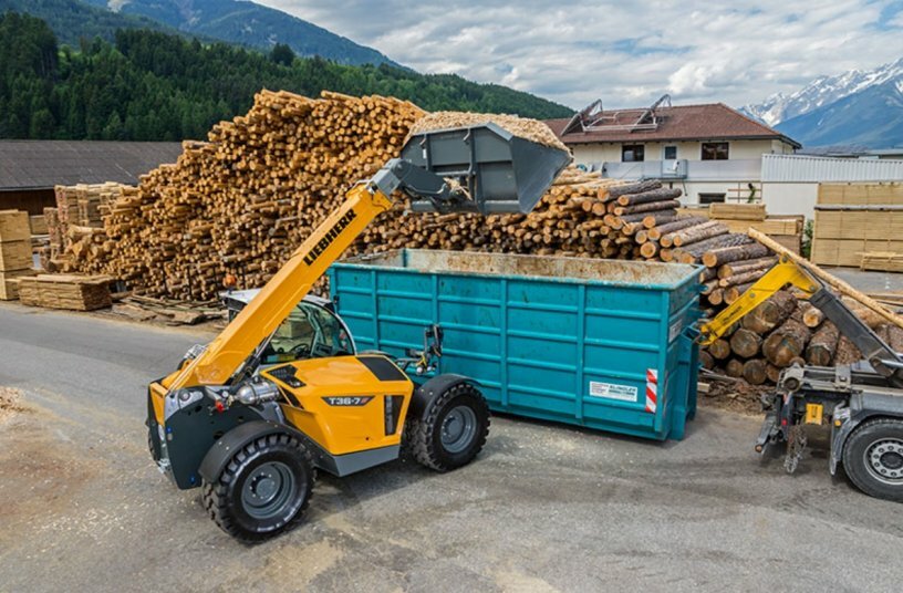 The Liebherr T-36-7s loads wood chips into a container.<br>IMAGE SOURCE: Liebherr-International Deutschland GmbH