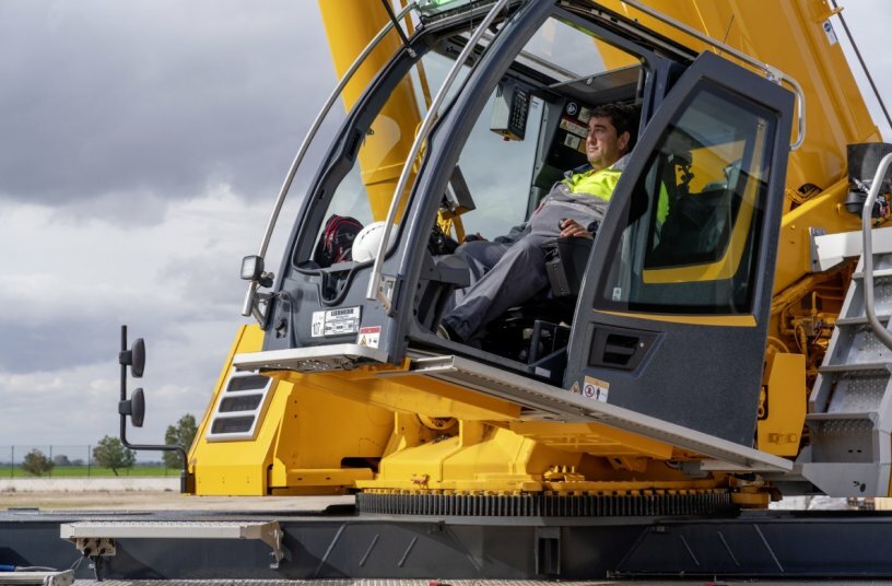 Very happy with his new tool, both on the construction site and on the road: crane driver Lucinio Gallego.<br>IMAGE SOURCE: Liebherr-Werk Ehingen GmbH