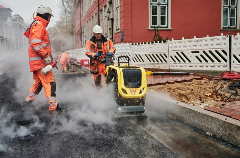 New on the market is the Wacker Neuson DPU62 vibratory plate, shown here performing compaction of asphalt for a new roadway.<br>IMAGE SOURCE: Wacker Neuson SE