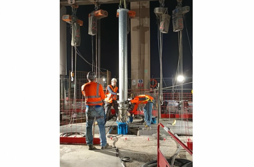 Installation of a pipe extension for a height difference of 21 metres.<br>IMAGE SOURCE: Tsurumi