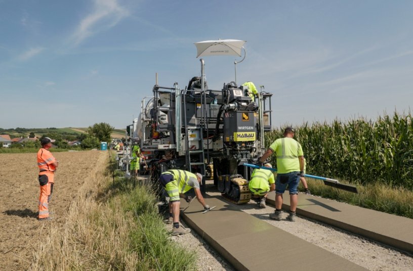 The compact slipform paver SP 33 enables precise paving of a range of different profiles, such as, for example, two-track farm road profiles.<br>IMAGE SOURCE: WIRTGEN GROUP