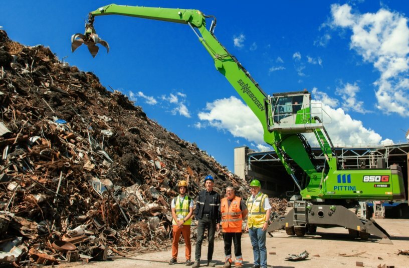 Pasqual Matteo from Cesaro Mac Import, plant manager at Pittini Osoppo Stefano Lui, operator at Pittini Osoppo Ennio Coppetti, and Sennebogen salesman Paolo Boscoscuro from Cesaro Mac Import (from left to right).<br>IMAGE SOURCE: Sennebogen