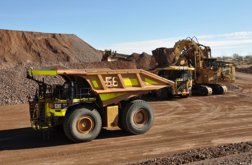 Cat autonomous truck stages for loading as ... ading another 793F CMD in demonstration<br>IMAGE SOURCE: Caterpillar