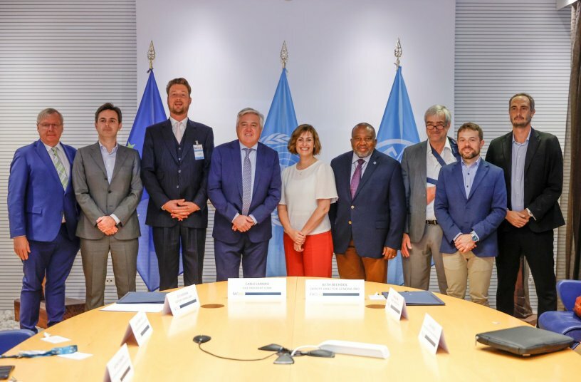 Beth Bechdol, FAO Deputy Director-General, and Carlo Lambro, CEMA Vice President stand for a group photo at the end of the FAO/CEMA Signing ceremony at the FAO headquarters.<br>IMAGE SOURCE: © FAO