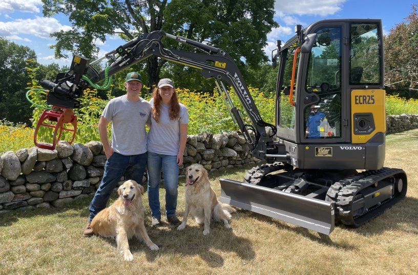  Tylan and Jennifer (and their dogs, Ralph and Daisy) with their new ECR25 Electric compact excavator.<br>IMAGE SOURCE: Volvo Construction Equipment