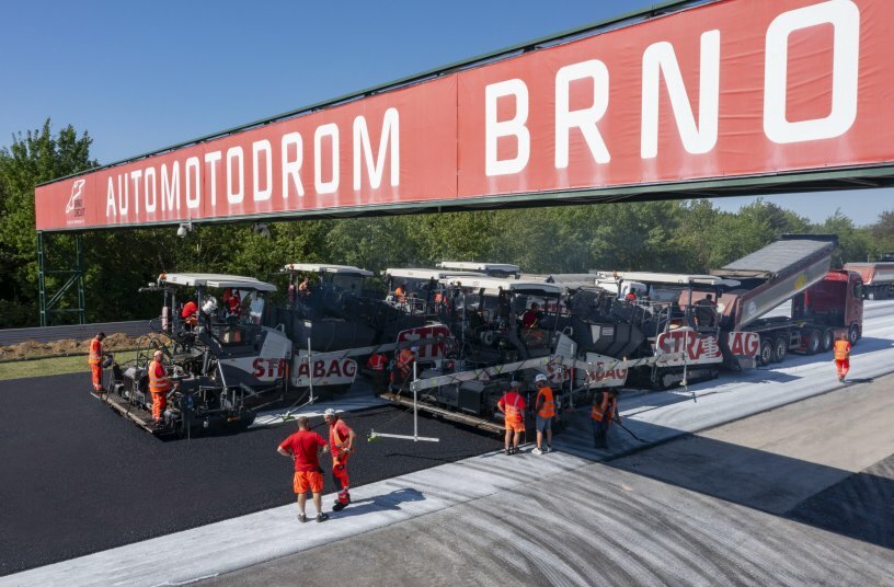 Three Vögele SUPER 1800 3i pavers and three MT 3000 2i Standard material feeders on the starting and finishing straight of the Automotodrom Brno.<br>IMAGE SOURCE: WIRTGEN GROUP