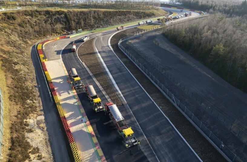 Aerial shot of the new T8Moto and T9Moto motorcycle race corners on the Spa-Francorchamps race track which is steeped in tradition: three SUPER 1800-3i pavers paved the surface course without joints using the hot-to-hot process.<br>IMAGE SOURCE: WIRTGEN GROUP