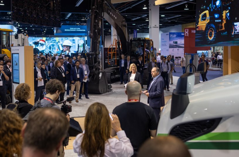 Dr. Ray Gallant shares Volvo CE e-mobility updates near the EC230 Electric excavator at the Volvo Group press event at ACT Expo.<br>IMAGE SOURCE: Volvo Construction Equipment