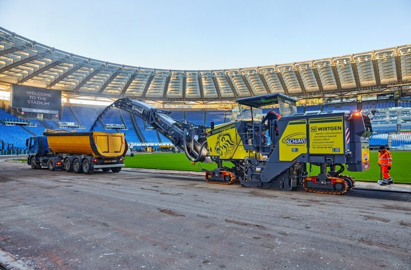 The high-performance Wirtgen W 200 Fi cold milling machine at work on the renovation of the athletics track in Rome’s Olympic Stadium. <br>IMAGE SOURCE: WIRTGEN GROUP