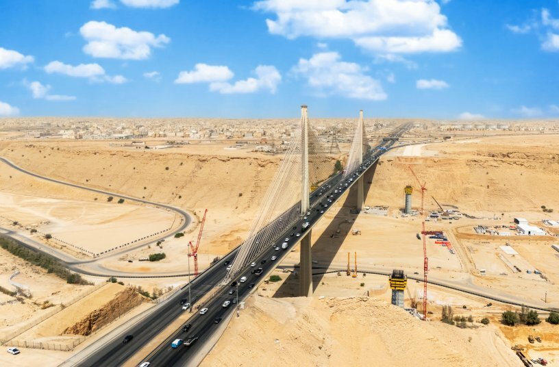 In the midst of the desert landscape southwest of Riyadh, threeWOLFF 180 B luffing jib cranes are supporting the construction ofthe new cable-stayed bridges over the Wadi Laban Valley. Theconstruction project is part of a large-scale infrastructure initiativein Riyadh that, according to official statements, is expected toincrease the capacity of the road network by up to 85 percent inthe long term.<br>IMAGE SOURCE: WOLFFKRAN International AG