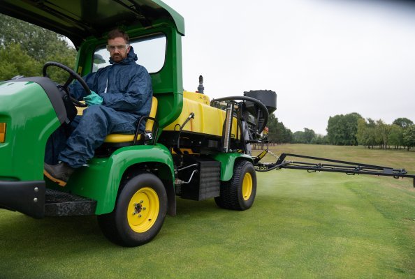 Steve Hardy spraying a green at TLGC with the John Deere HD200