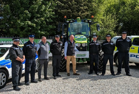 Devon and Cornwall Police receive the tractor from Masons Kings