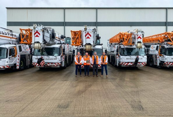 Left to right: Fraser Pierce, Jamie Pierce, and Dave Ryan from J&D Pierce with Derek Kidd of Manitowoc.