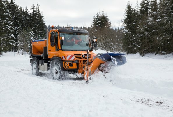 Unimog implement carrier in winter service