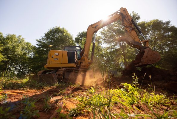 Cat 308 CR Mini Excavator using MHE Ease of Use features during septic installation.