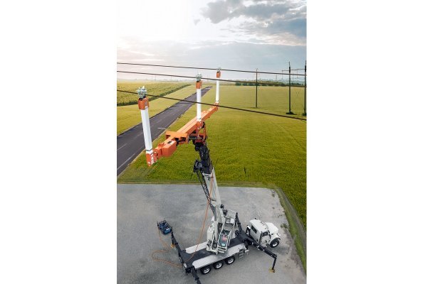 The National Crane NBT60XL matched with the LineWise TLL-2000 Series 3 Triple Line Lifter expands the scope of work for electric utility contractors.