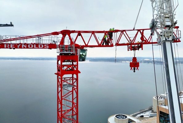 Potain tower cranes help transform Madison’s downtown skyline under an airport flight path