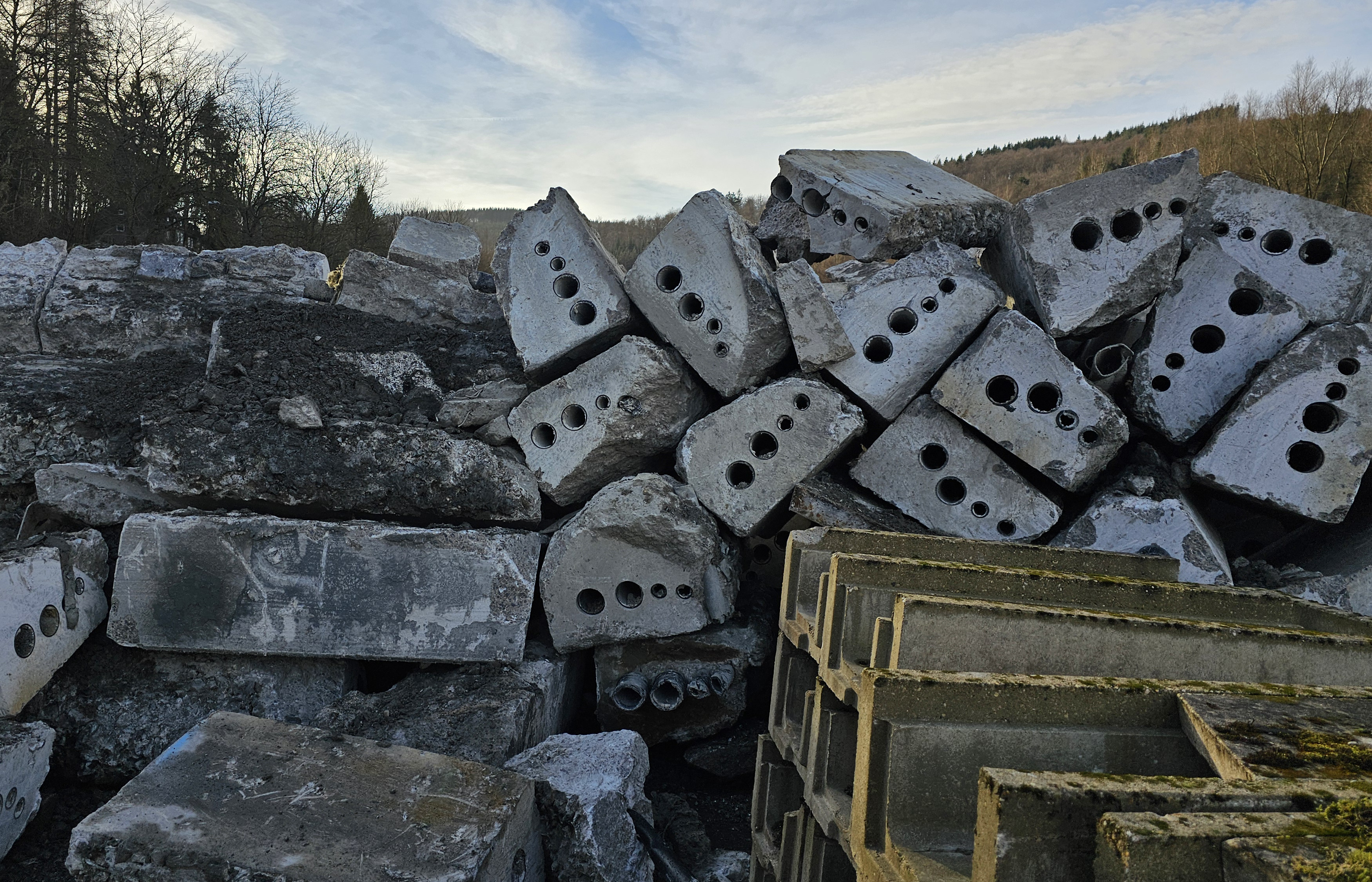 The cut-out sections of concrete cable duct are transported out of the tunnel and ready for recycling.