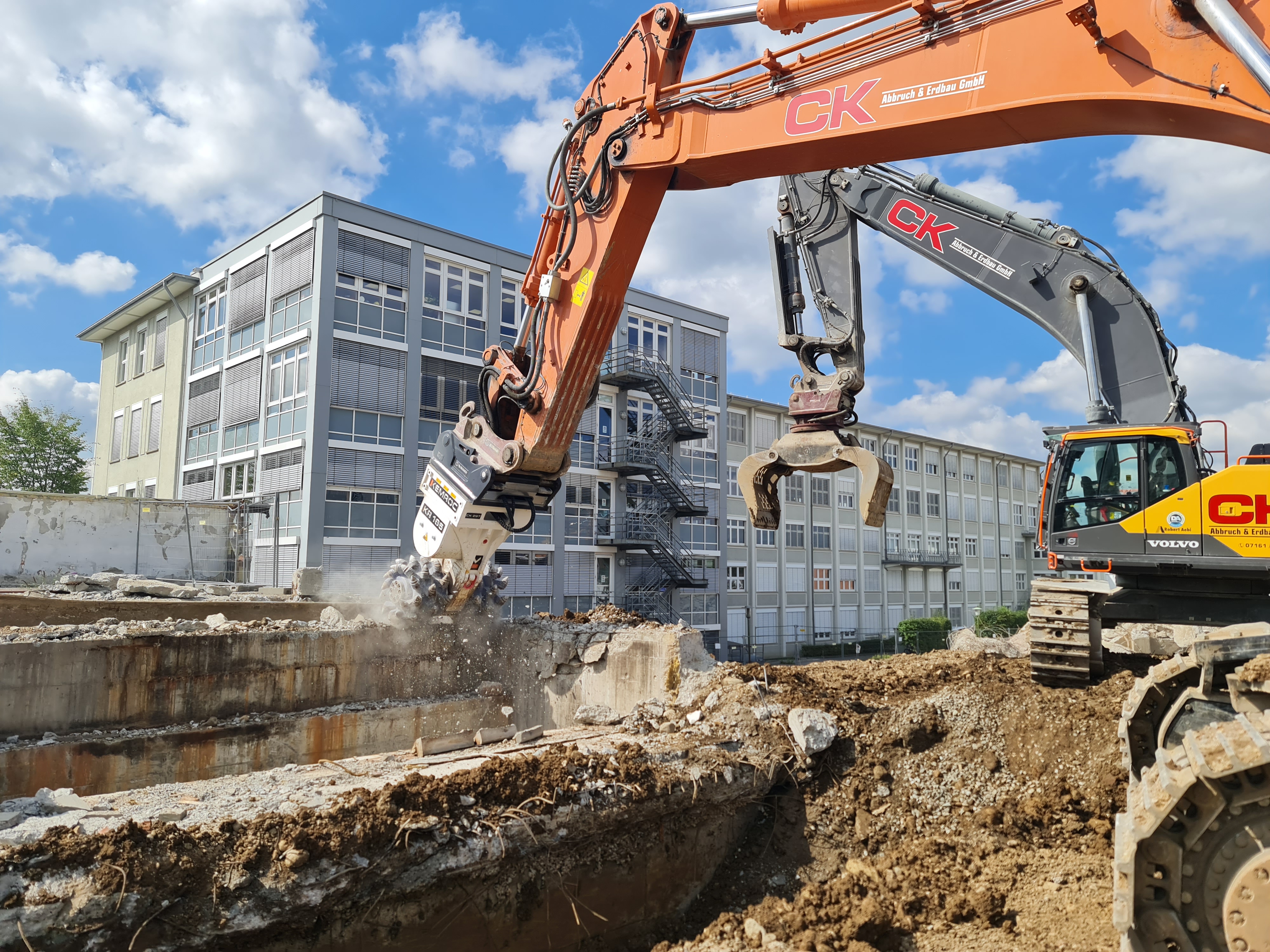 Drum cutter attachments used near buildings on the boundary. Unlike cutter wheels, they can work right up to the boundary.