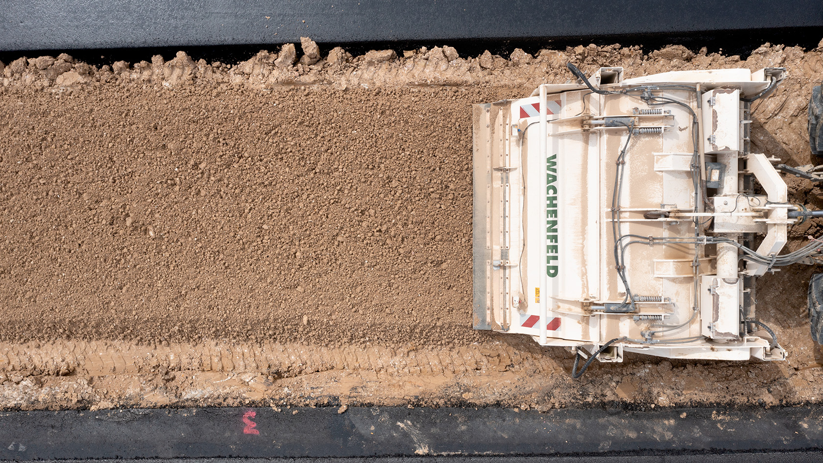 A Wirtgen Group machine train on a landfill construction pro-ject in the Kassel District of Germany <br> Image source: WIRTGEN GROUP